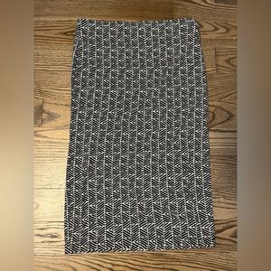 Forever21 - size Medium, straight, mid-calf skirt. Light pink and black pattern